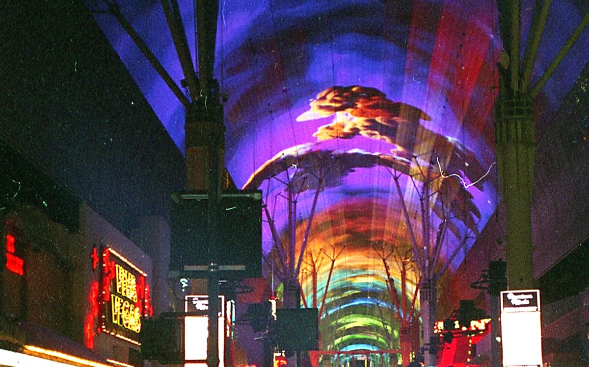 The Fremont Street Experience canopy lit up at night